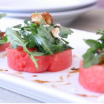 watermelon salad with arugula, goat cheese, and candied walnuts